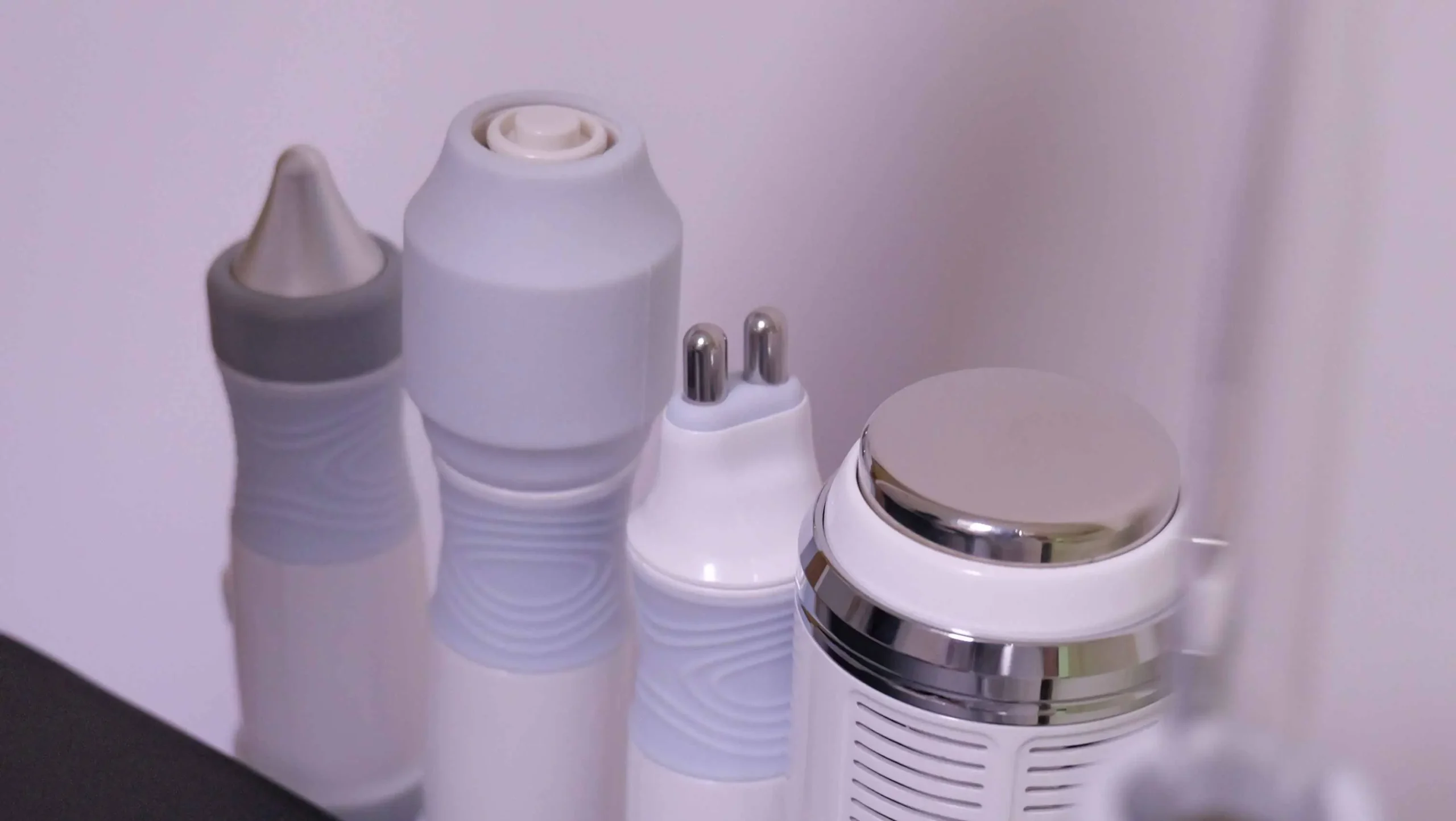 Multiple treatment handpieces for hydrodermabrasion machine